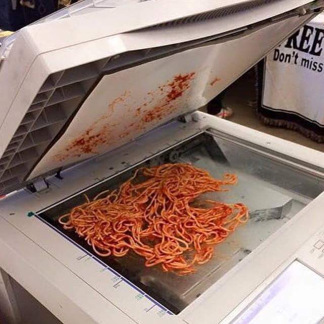 Spaghetti loaded into a copier tray.