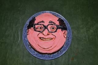 Painted face plate with a frozen grin.