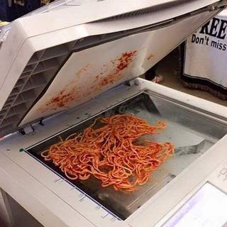Spaghetti loaded into a copier tray.
