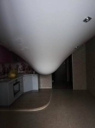 Ceiling water leak over an empty room.