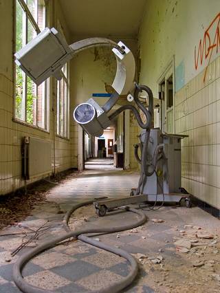 A large medical machine with a head opening in an abandoned Antwerp hospital.