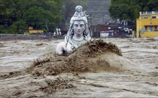 Partially Submerged Statue of Shiva the Destroyer During the Flash Flood in Uttrakhand. from Reddit r/oddlyterrifying.