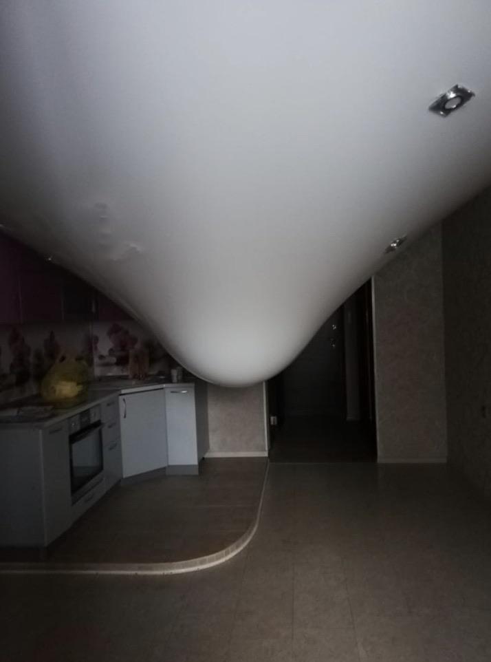 Ceiling water leak over an empty room.