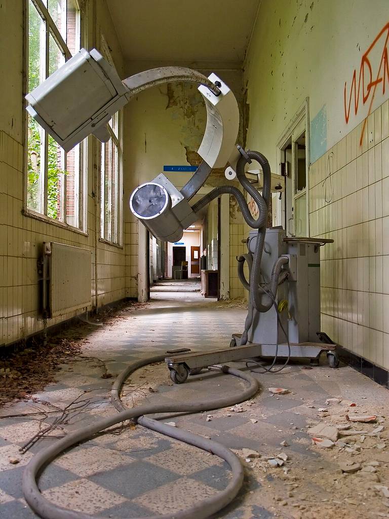 A large medical machine with a head opening in an abandoned Antwerp hospital.