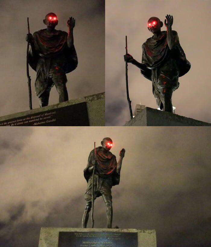 Mahatma Gandhi's Statue After Some Prankster Added red Lights to the Eyes of it (San Francisco,  from Reddit r/oddlyterrifying.