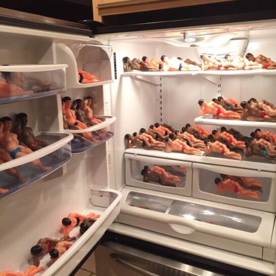 Cursed image of a refrigerator packed with toy figures in swimwear.